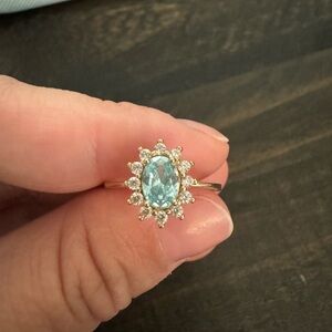 Size 9 aquamarine ring with moissanite stones. 14 k gold